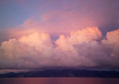 Sunset and pink clouds Stock Photos