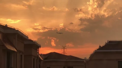 Sunset and Plane landing Stock Footage 137267144