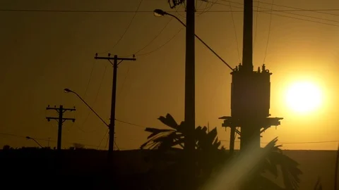 Sunset and power poles Stock Footage 73898711