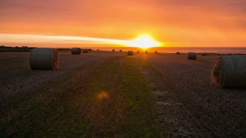 Sunset and Rain over a field of Bails in Birsay Orkney HD Time Lapse Stock-Footage 256084138