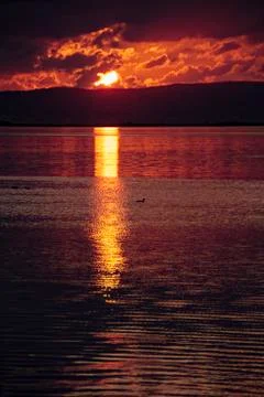 Sunset and reflections on the lagoon Stock Photos