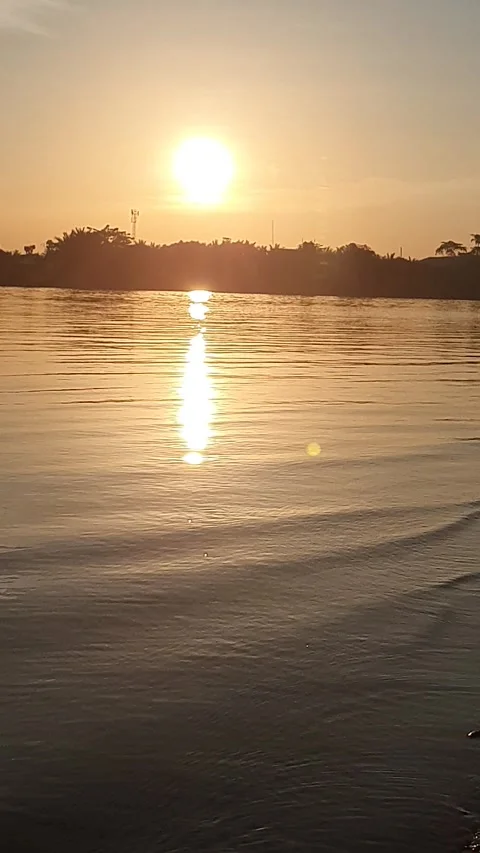 Sunset and ripples of river water in West Kalimantan, Indonesia Видео 337552215