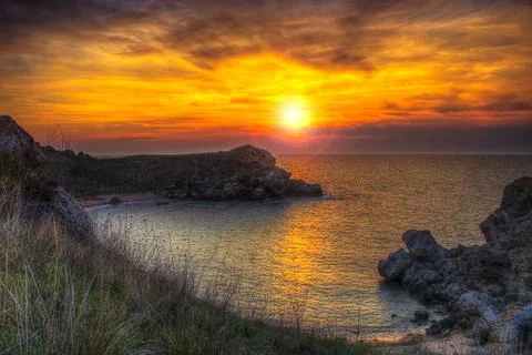 Sunset and rocks Stock Photos