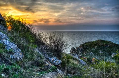 Sunset and rocks Stock Photos