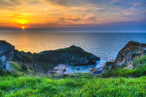 Sunset and rocks Stock Photos