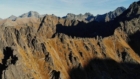 Sunset and rocky mountain peaks. Sharp tops of mountains in summer Stock Footage 120582011