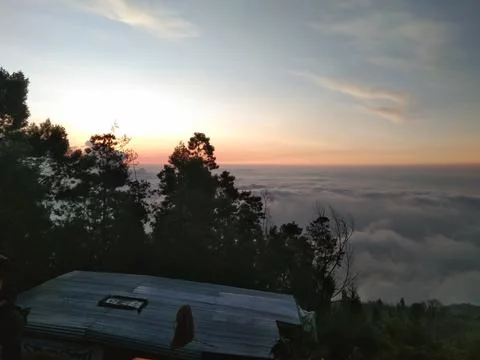 Sunset and sea of cloud Stock Photos