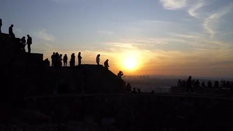 Sunset and silhouettes of people Video stock 119689785