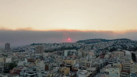 Sunset and smoke from a forest fire over Athens, Greece Stock Footage 307896362