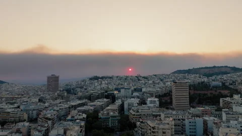 Sunset and smoke from a forest fire over Athens, Greece Stock Footage 307896629