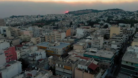 Sunset and smoke from a forest fire over Athens, Greece Stock Footage 307896650