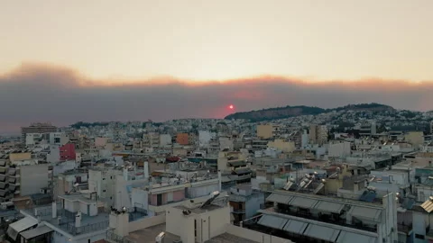 Sunset and smoke from a forest fire over Athens, Greece Stock Footage 307896736