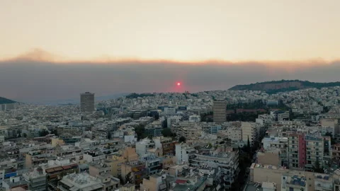 Sunset and smoke from a forest fire over Athens, Greece Stock Footage 307896909