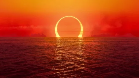 Sunset and solar eclipse over seamlessly looped ocean.  Stock Footage 80679191