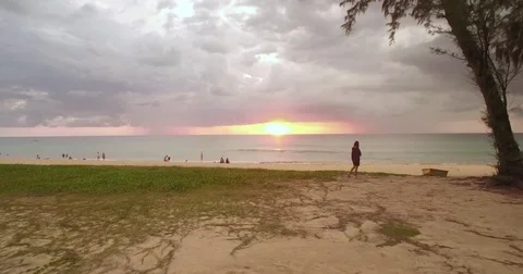 Sunset And Storm Clouds Over Tropical Beach In Phuket, Thailand, Aerial Push Video stock 80177296