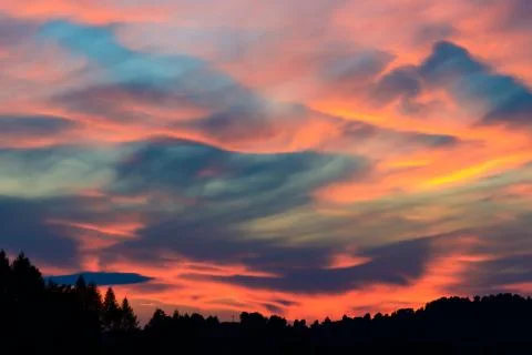 Sunset and stormy clouds over fields and hills in Pieniny Mountains 写真素材