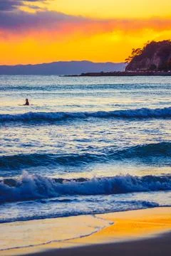 Sunset and surfer Foto stock