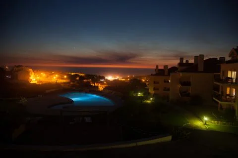 Sunset and swimmingpool Stock Photos