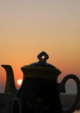 Sunset and tea set Stock Photos