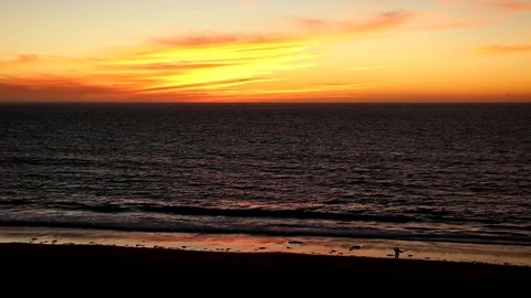 Sunset and waves with silhouette image of a person Video stock 82447336