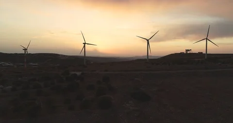 Sunset and wind turbines 4K Stock Footage 103790606
