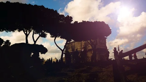 Sunset on the Arch of Constantine, triumphal arch near the Colosseum in the Video stock 97874399
