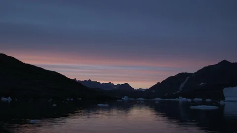 Sunset on the Arctic Ocean and his mountains, Greenland Stock Footage 103603769