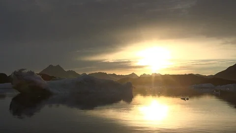 Sunset on the Arctic Ocean and his mountains, Greenland Video stock 103608560