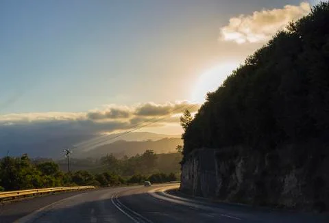 Sunset around corner on road Stock Photos