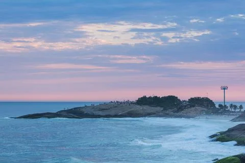 The sunset at the Arpoador Stone between Ipanema and Copacabana beach. Brazil. Stock Photos