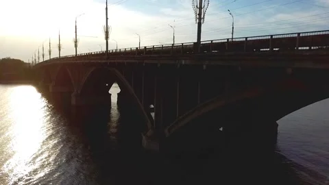 Sunset. Ascent above the bridge on which cars go Video stock 134569924