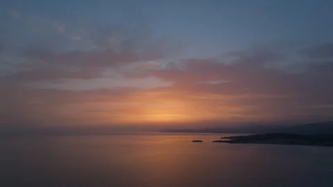 Sunset ascent over tranquil bay Stock Footage 264074363