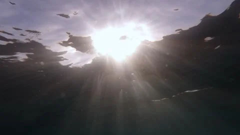 Sunset Ascent: Slow Motion Journey from Depths to Surface Stock Footage 263755462
