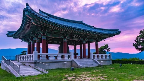 The sunset atmosphere, The park with old bells are stored in the pavilion Tim Stock Footage 111697737