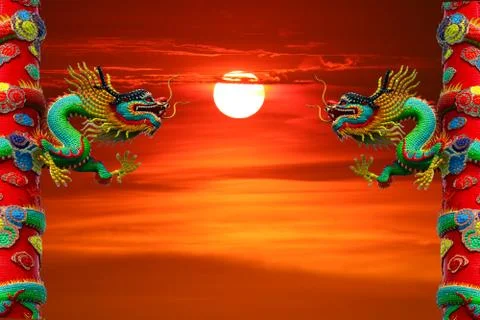 Sunset back between two pillars of dragon red sky Stock Photos