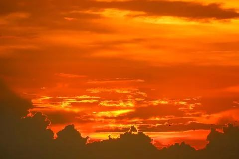 Sunset back on last light red orange sky silhouette cloud Stock Photos
