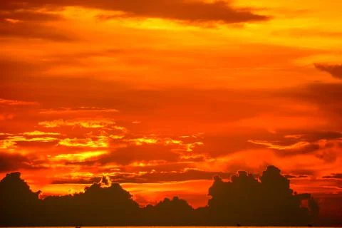 Sunset back on last light red orange sky silhouette cloud Stock Photos