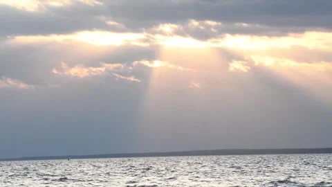 Sunset background on bay with sun rays through clouds Stock Footage 342142114