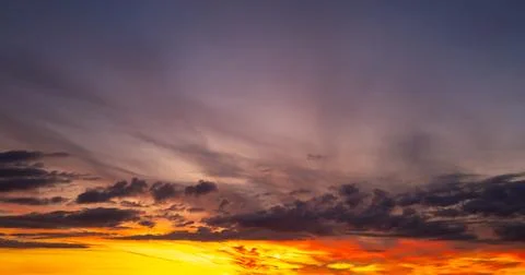 Sunset background. Dramatic majestic scenery sunset. Sky with clouds in sunset Stock Photos