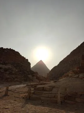 Sunset on the background of the Egyptian pyramids Stock Photos