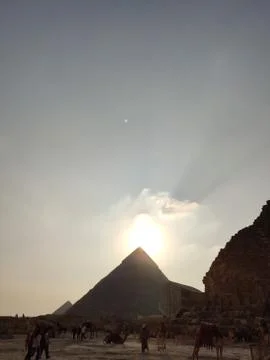 Sunset on the background of the Egyptian pyramids Stock Photos