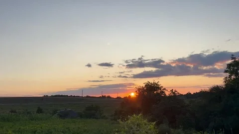 Sunset on the background of green nature Stock Footage 247222007