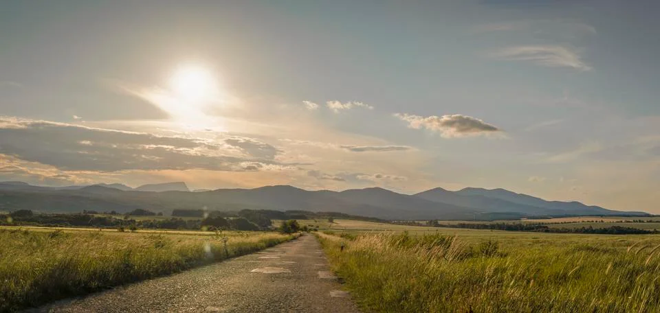 Sunset in the background of the mountain Stock Photos