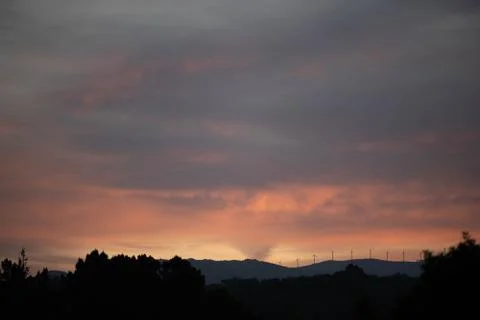 A sunset in the background over de mountains Stock Photos