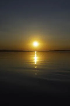 Sunset background photo. Sunset or sunrise over the lake. Stock Photos