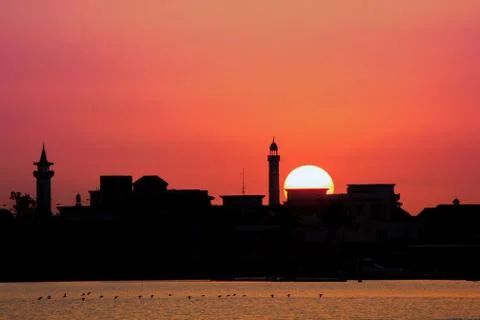 Sunset background in river with the mosque in th shadow. Photos