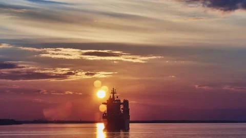 Sunset on the background of a river with a ship, time lapse Stock Footage 163077510