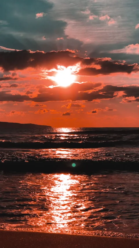 Sunset background Silhouette of sea waves Vertical video Stock Footage 234884710