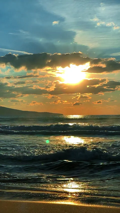 Sunset background Silhouette of sea waves Vertical video Stock Footage 234884715