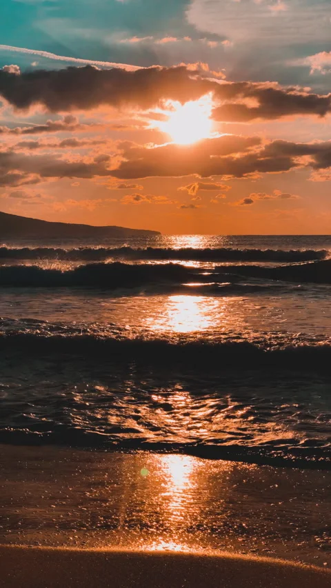 Sunset background Silhouette of sea waves Vertical video Stock Footage 234884731